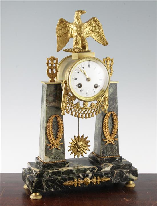 A French Empire style ormolu mounted green marble portico clock, 15.5in.